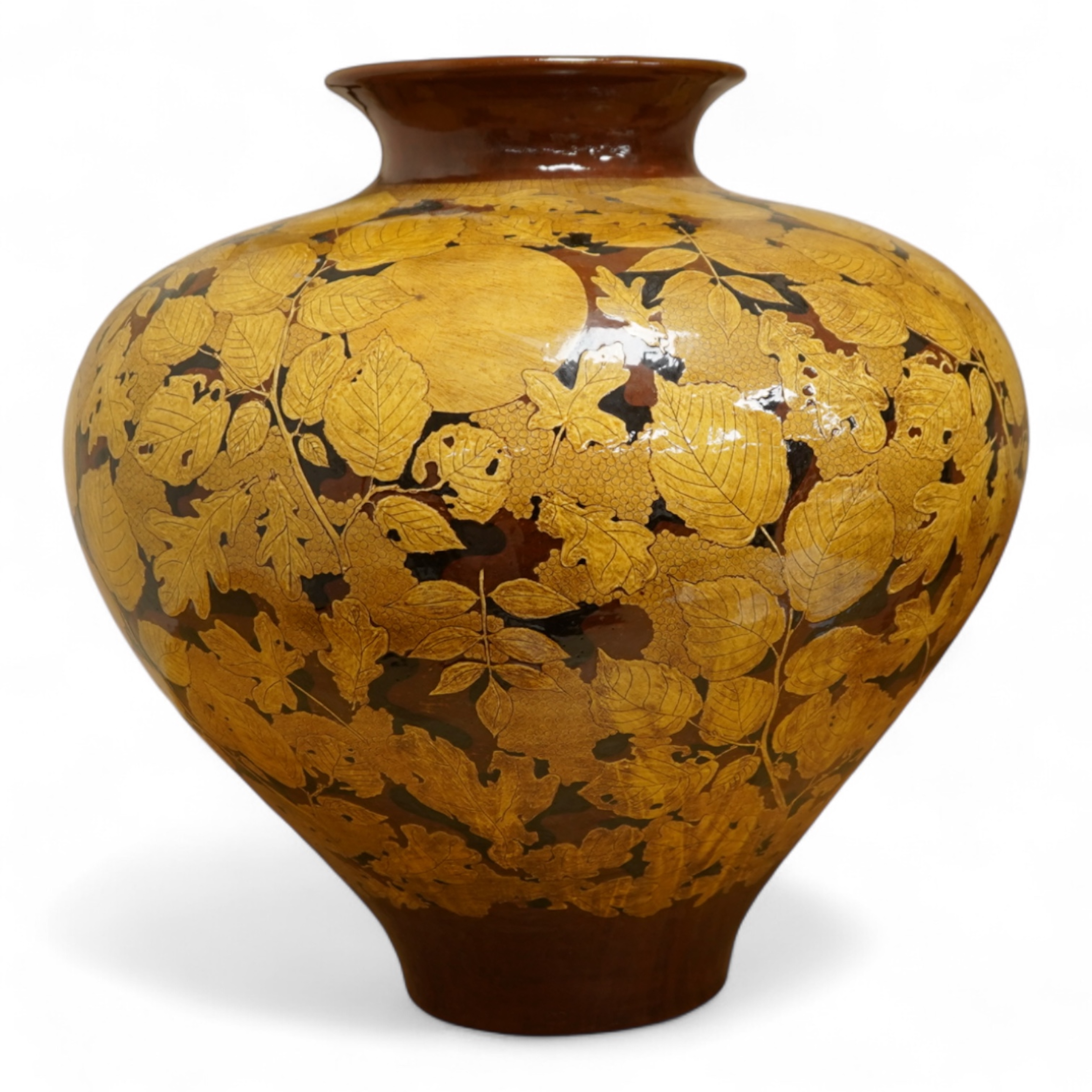 A large terracotta foliaiate decorated vase, 38cm high